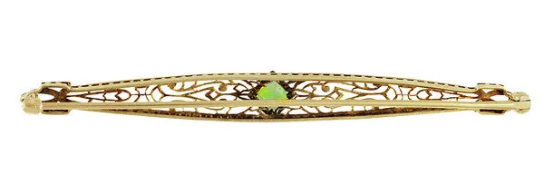 Art Deco Filigree Peridot Bar Brooch in 14 Karat White and Yellow Gold