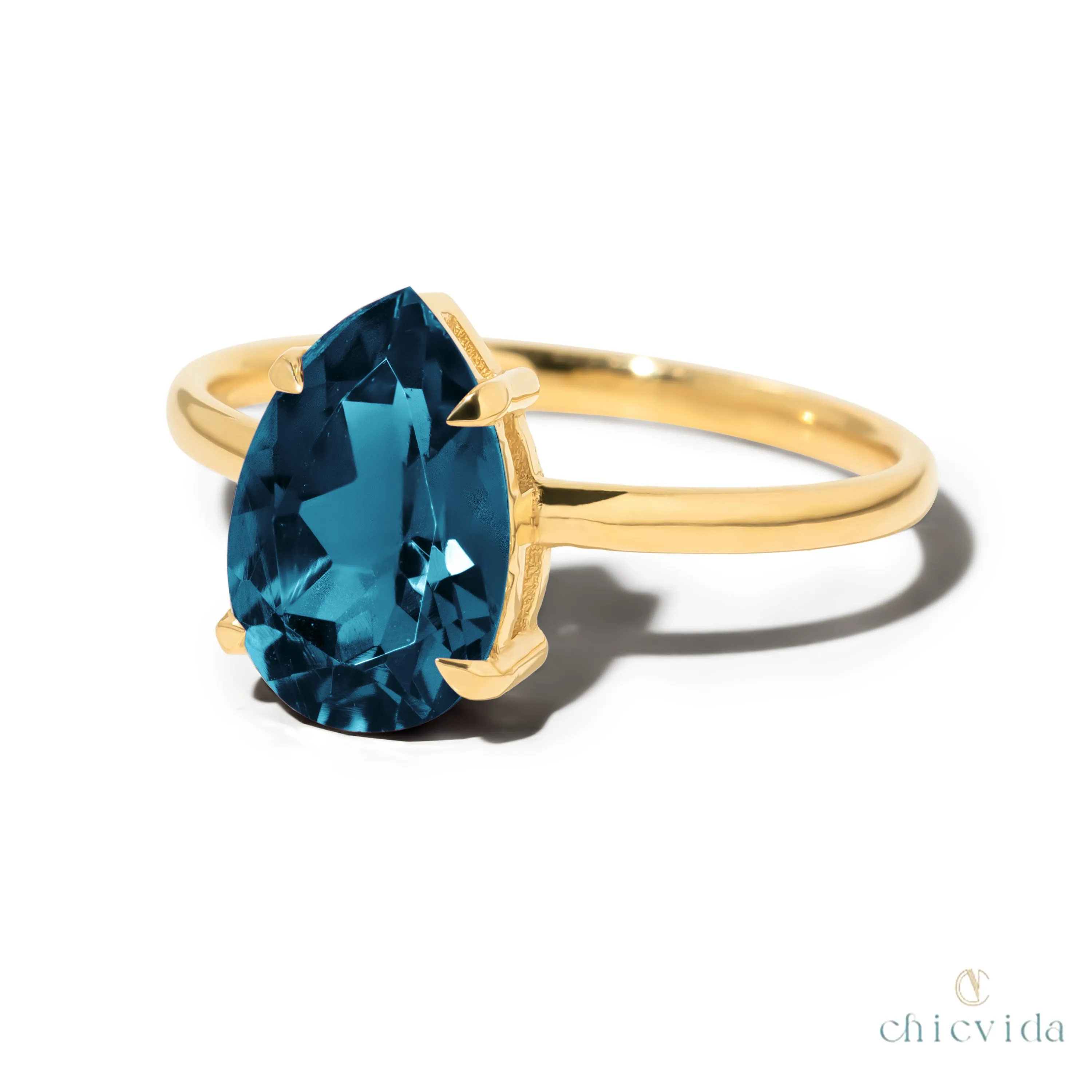 Cameo Teardrop Blue Topaz Solitaire Ring