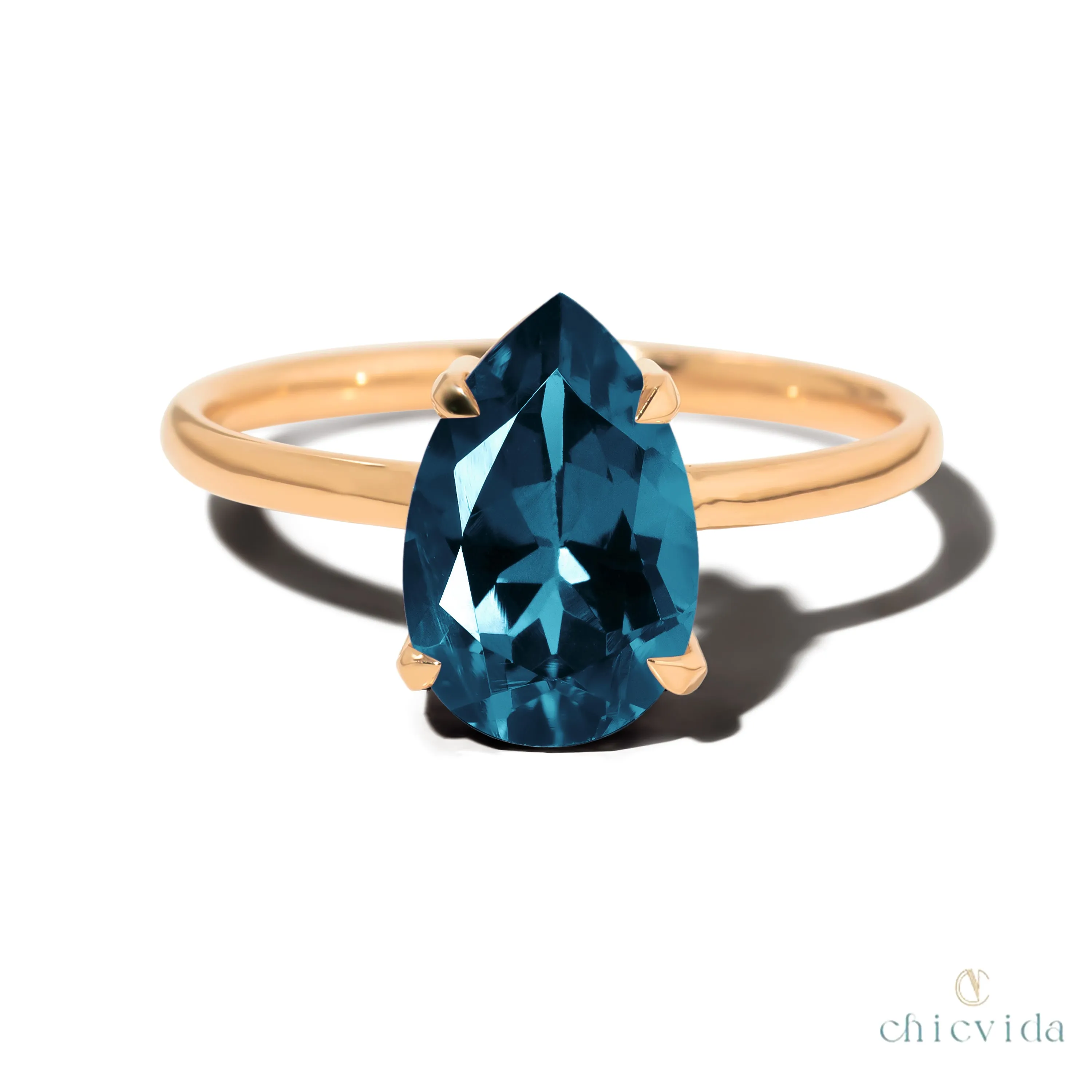 Cameo Teardrop Blue Topaz Solitaire Ring