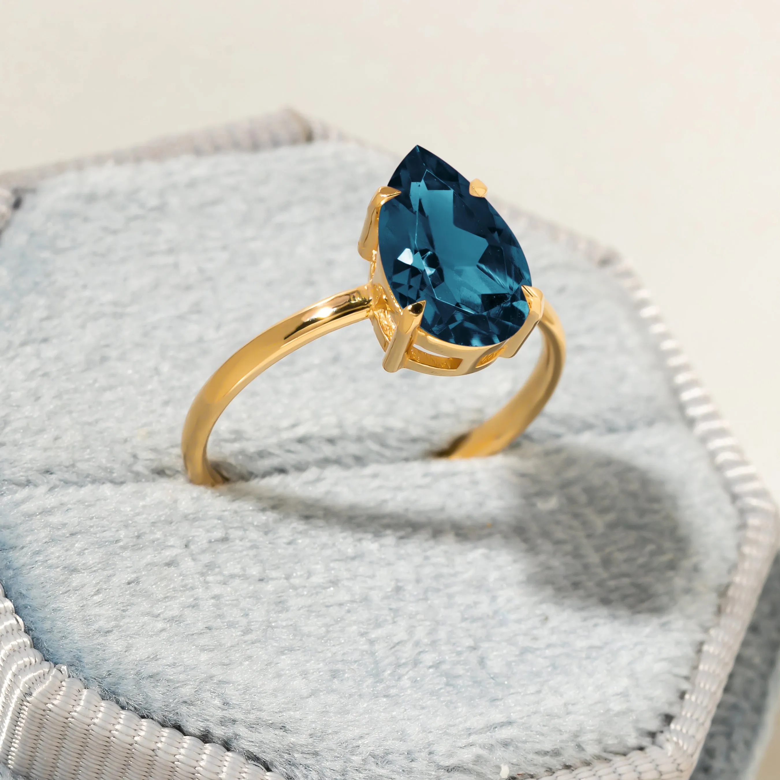 Cameo Teardrop Blue Topaz Solitaire Ring