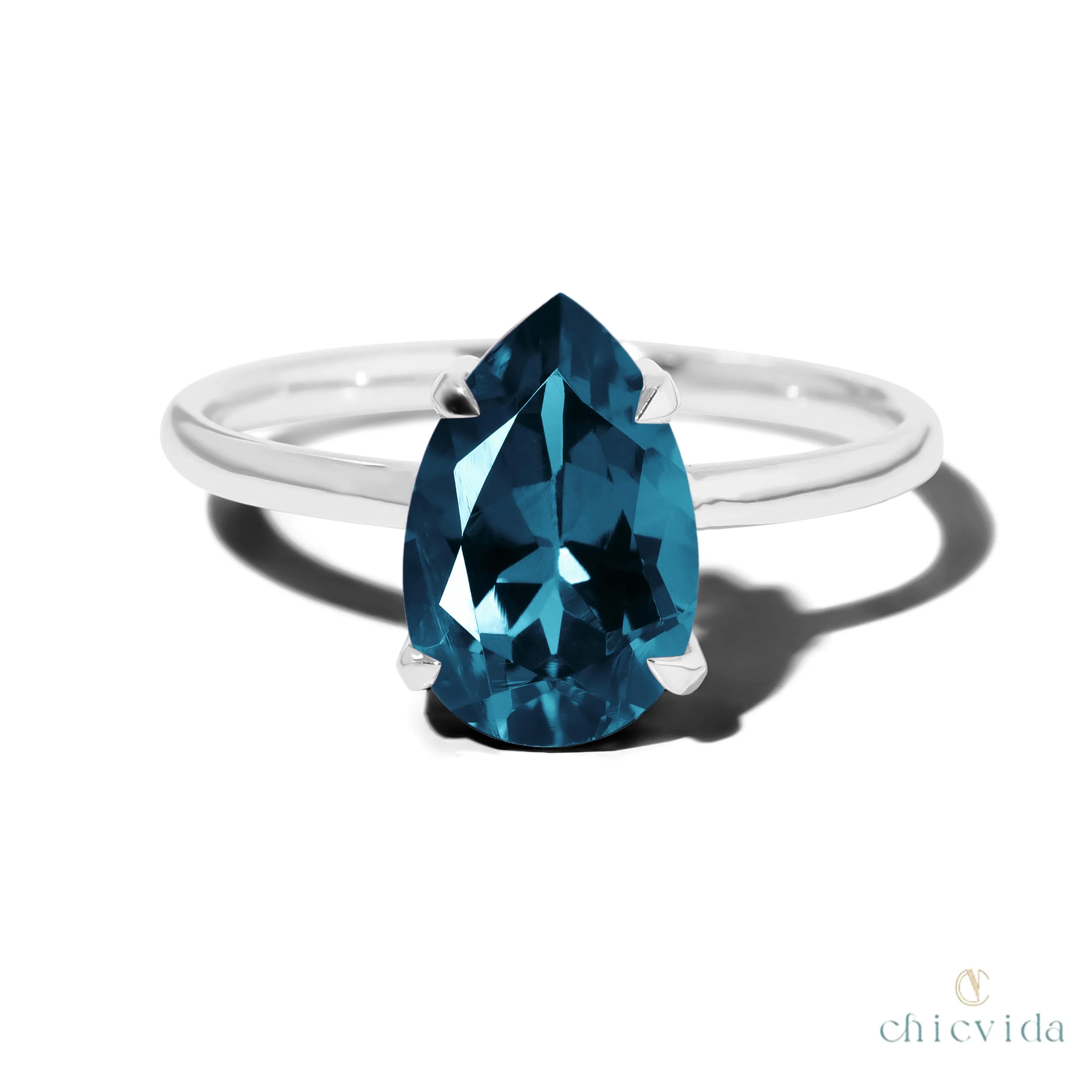 Cameo Teardrop Blue Topaz Solitaire Ring