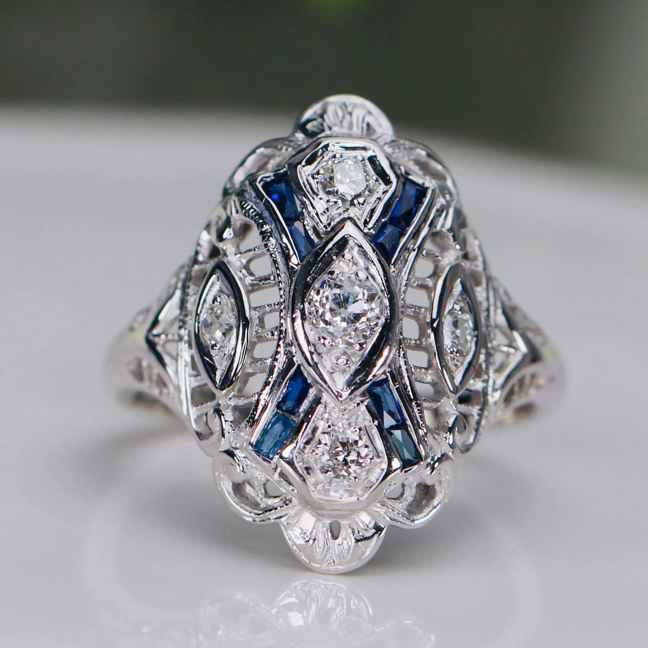 Detailed Vintage OMC diamond and sapphire plaque ring in 14k white gold